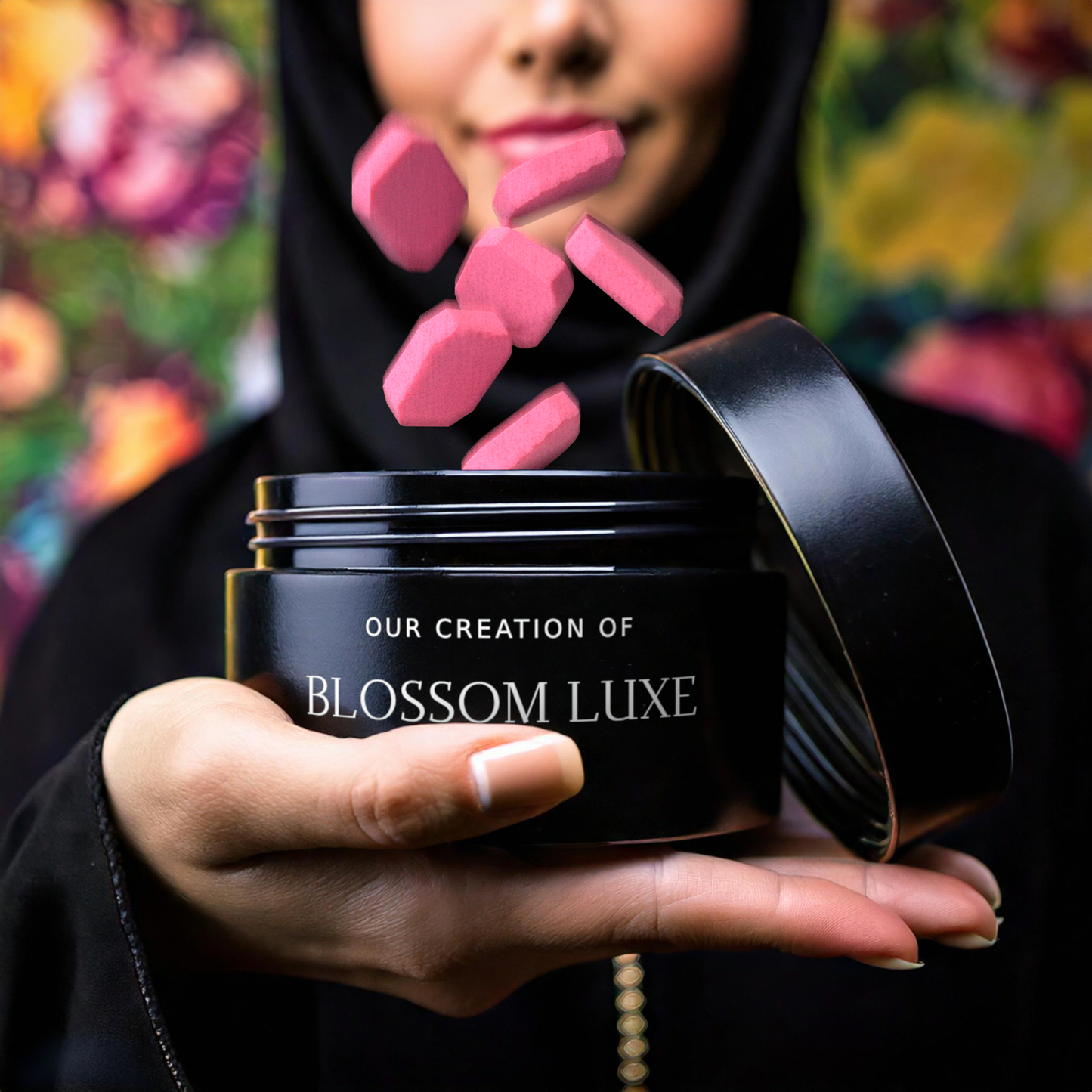 A close-up of a person holding a Nuarai® Blossom Luxe bakhoor jar with vibrant pink capsules floating above, set against a colorful floral background, inspired by Gucci Bloom’s blooming elegance and charm.